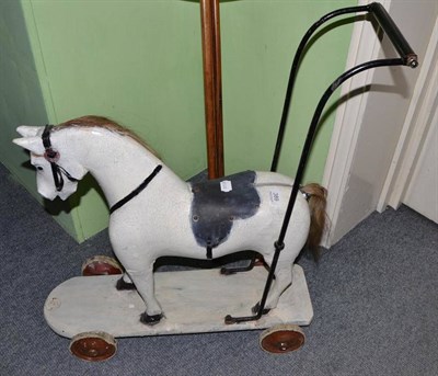 Lot 389 - Early 20th century push-along toy horse