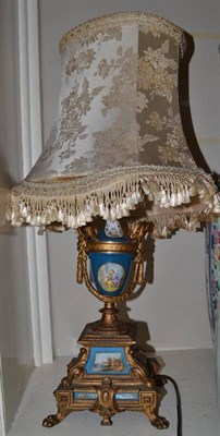 Lot 398 - French gilt and porcelain panelled urn, converted to an electric lamp