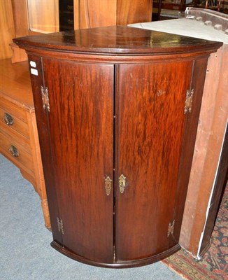 Lot 617 - Georgian mahogany corner cabinet, four shelves and three drawers