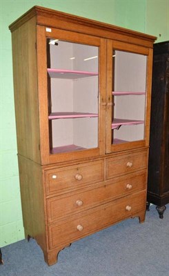 Lot 623 - Glazed cabinet on chest