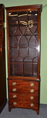 Lot 626 - An early 19th century mahogany cupboard and an associated bookcase top