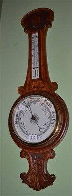 Lot 630 - Carved oak aneroid barometer