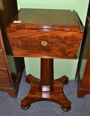 Lot 631 - An early Victorian mahogany teapoy, the octagonal column supporting a rectangular caddy with...