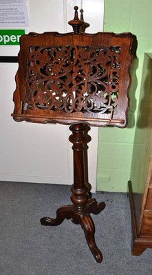 Lot 634 - Victorian rosewood duet stand with fret pierced stands