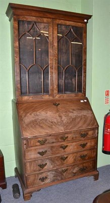 Lot 643 - An early 19th century mahogany bureau bookcase