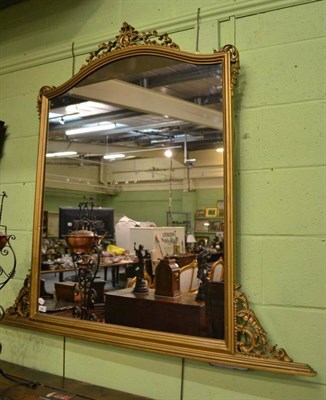 Lot 646 - A gilt overmantel mirror