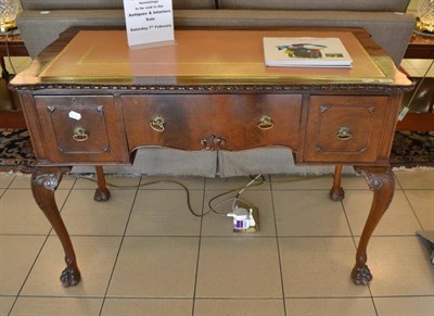 Lot 658 - A reproduction mahogany writing desk on cabriole legs