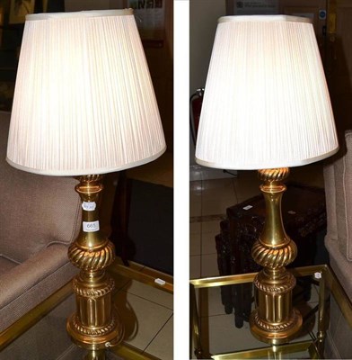 Lot 665 - A pair of gilt metal table lamps