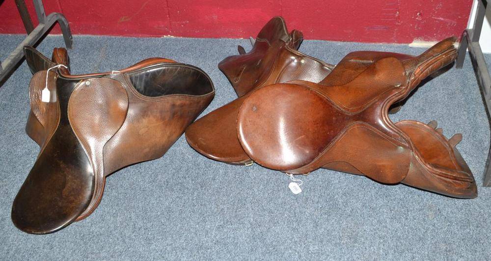 Lot 696 - Three leather saddles