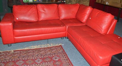 Lot 701 - A red leather corner sofa