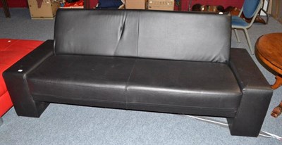 Lot 702 - A black leather sofabed