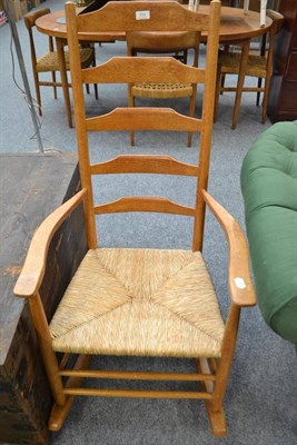 Lot 711 - Shaker style light oak rocking chair