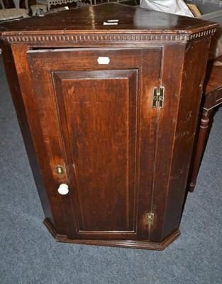 Lot 717 - An 18th century oak hanging corner cupboard