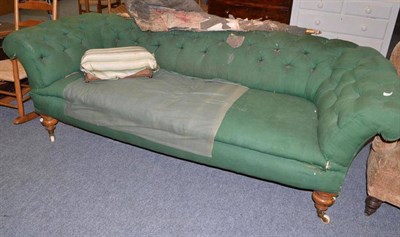 Lot 719 - A large green upholstered Chesterfield settee