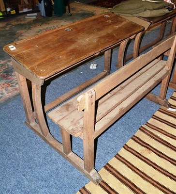 Lot 782 - An oak double seated child's desk