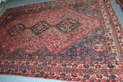 Lot 811 - Kashgai carpet, South West Persia, the faded rose field of tribal motifs centred by three...