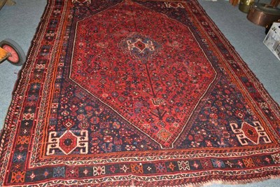 Lot 812 - Kashgai carpet, South West Persia, the claret field of tribal devices centred by a stepped...