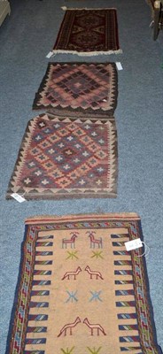 Lot 815 - Bukhara mat, probably Afghanistan, the crimson field with two medallions framed by rosette borders