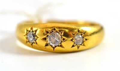 Lot 11 - An 18ct gold three stone diamond set gypsy ring