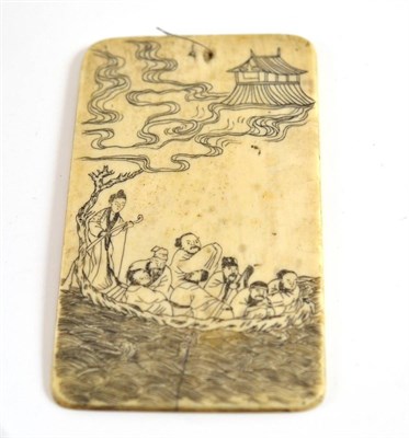 Lot 31 - A Japanese carved ivory tablet, one side with figures on a boat, the other with Japanese...