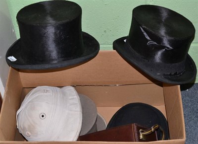 Lot 52 - Herbert Johnson bowler hat, three top hats, one polo helmet by Herbert Johnson and a pair of...