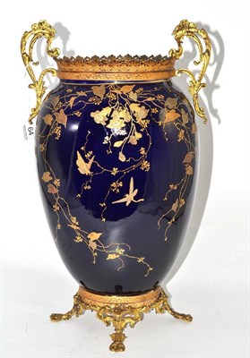 Lot 64 - A French earthenware vase with gilt decoration on a blue ground with gilt metal mounts