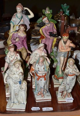 Lot 71 - Eight assorted 19th century pearlware figures, each on a square base with red striping and...