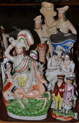 Lot 75 - A collection of Staffordshire figures, two water jugs, etc