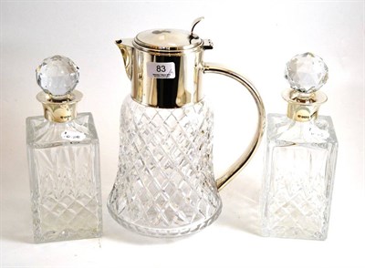 Lot 83 - A pair of silver topped decanters and a plated lemonade jug (3)