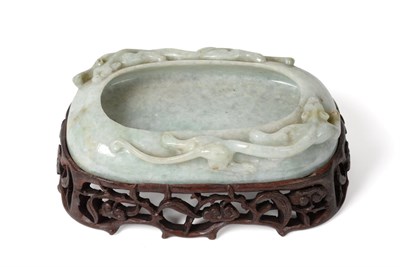 Lot 162 - A Chinese Jade Brush Washer, Qing Dynasty, of shallow ovoid form carved with three sinuous animals