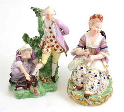 Lot 107 - Two Derby figures, woman seated in a chair and woman cleaning gentleman's shoes beside a stump