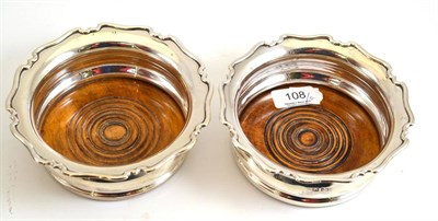 Lot 108 - A pair of silver wine coasters, Sheffield 1925