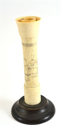 Lot 121 - A Japanese carved ivory and bone candlestick on a turned wooden base, circa 1920