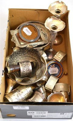 Lot 136 - A collection of assorted silver and white metal including eight napkin rings, pair of posy...