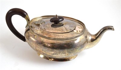 Lot 152 - A silver teapot with a wooden handle, Adie Brothers, Birmingham 1948