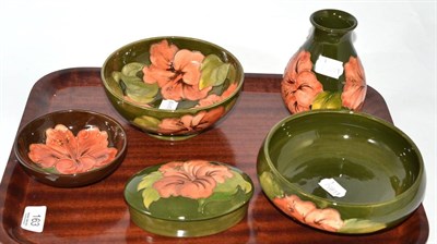 Lot 163 - Five pieces of Walter Moorcroft Coral Hibiscus on green and brown grounds