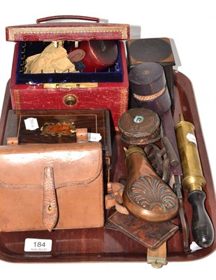 Lot 184 - A tray including a knuckle duster, a powder flask, a razor strop, leather cases etc