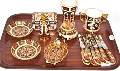 Lot 185 - A tray of assorted Royal Crown Derby pieces, seven knives, three pin dishes, table lighter, etc