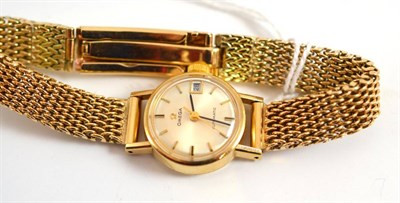 Lot 199 - A lady's 9ct gold wristwatch, signed Omega, with attached 9ct gold bracelet