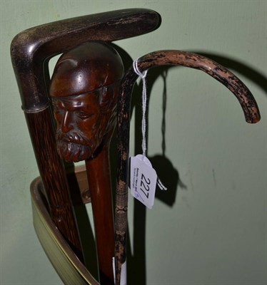 Lot 227 - Walking stick carved with head of Garibaldi, walking stick with plated handle and one other (3)