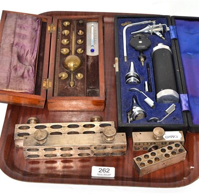 Lot 262 - Cased ophthalmoscope, four suppository moulds and cased Sike's hydrometer