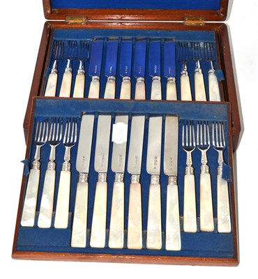 Lot 265 - An incomplete set of silver and mother-of-pearl dessert knives and forks, cased