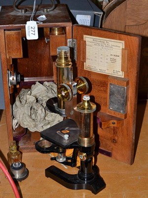 Lot 277 - A brass and ebonised monocular microscope and case