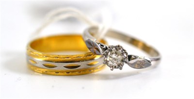 Lot 314 - An 18ct two colour gold band ring and a diamond solitaire ring, estimated diamond weight 0.25 carat