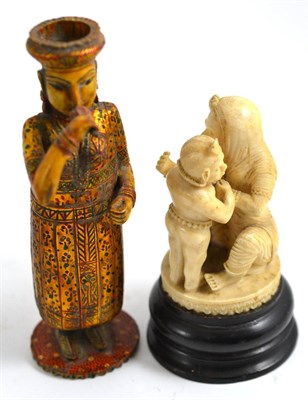 Lot 322 - A 19th century Indian carved ivory group and another figure