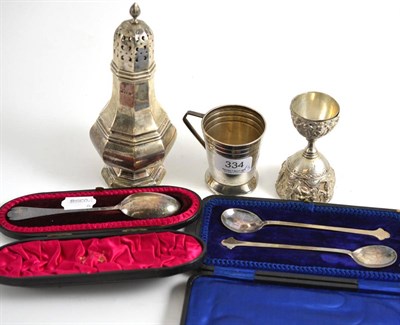 Lot 334 - A silver sugar caster Birmingham 1931, an Indian silver double egg cup, a Christening mug and...