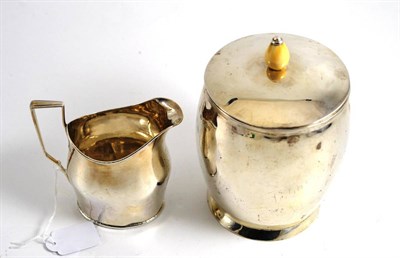 Lot 338 - A silver barrel and cover, retailed by Barraclough & Sons, Leeds and a Georgian silver jug