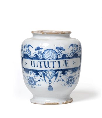 Lot 198 - A London Delft Drug Jar, circa 1730, inscribed in blue U-TUTIAE within a scroll label surmounted by