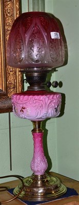 Lot 375 - Pink glass Victorian oil lamp and shade