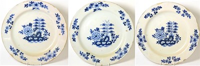 Lot 200 - A Set of Three English Delft Chargers, circa 1740, painted in blue with peony and bamboo...